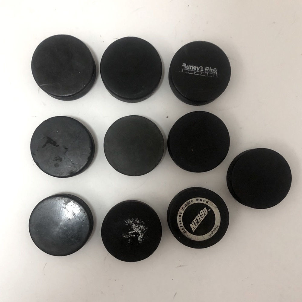 10 Used hockey pucks lot